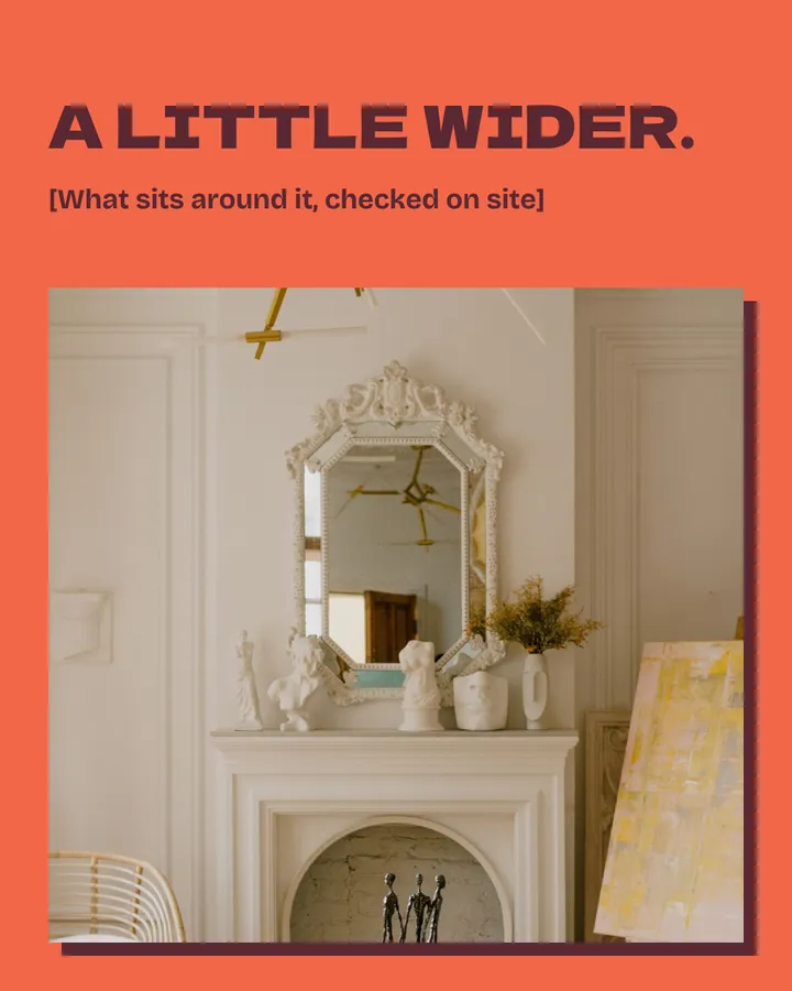 A little wider. A gold ceiling light, the mirror, the mantel and the top of an arched fireplace come into view, with a rattan chair at one edge and a yellow abstract painting on an easel at the other. A field asks what sits around the feature.